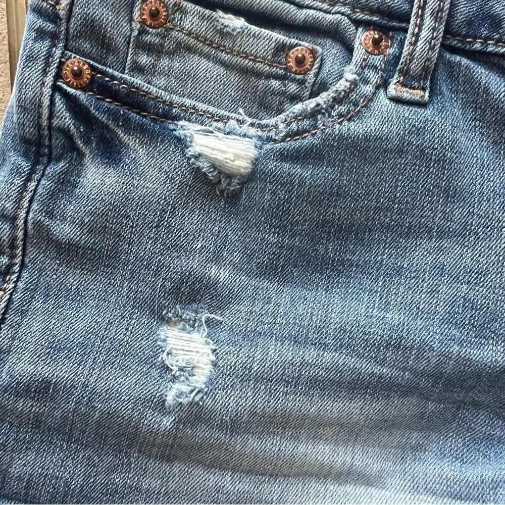 Distressed denim shorts.